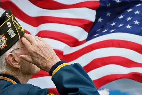 Veteran saluting the American flag in Idaho Falls.